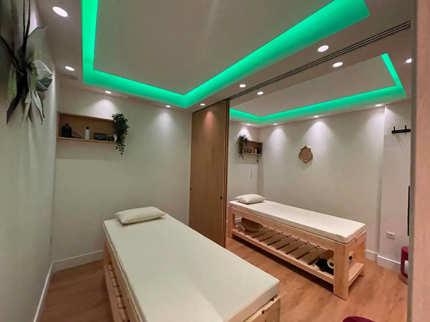 Couples treatment room with green ambient lighting