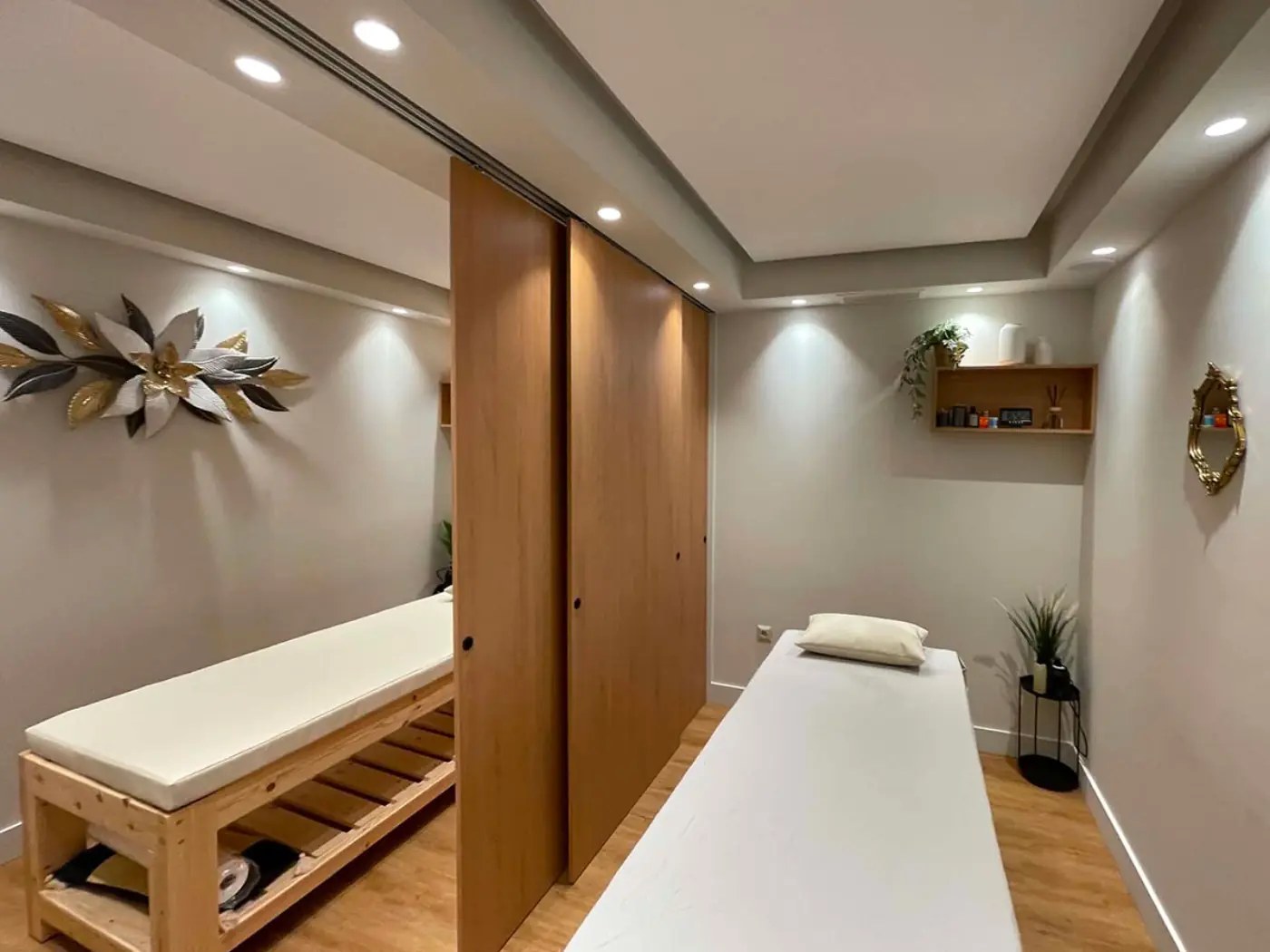 Couples treatment room with warm wood finishes